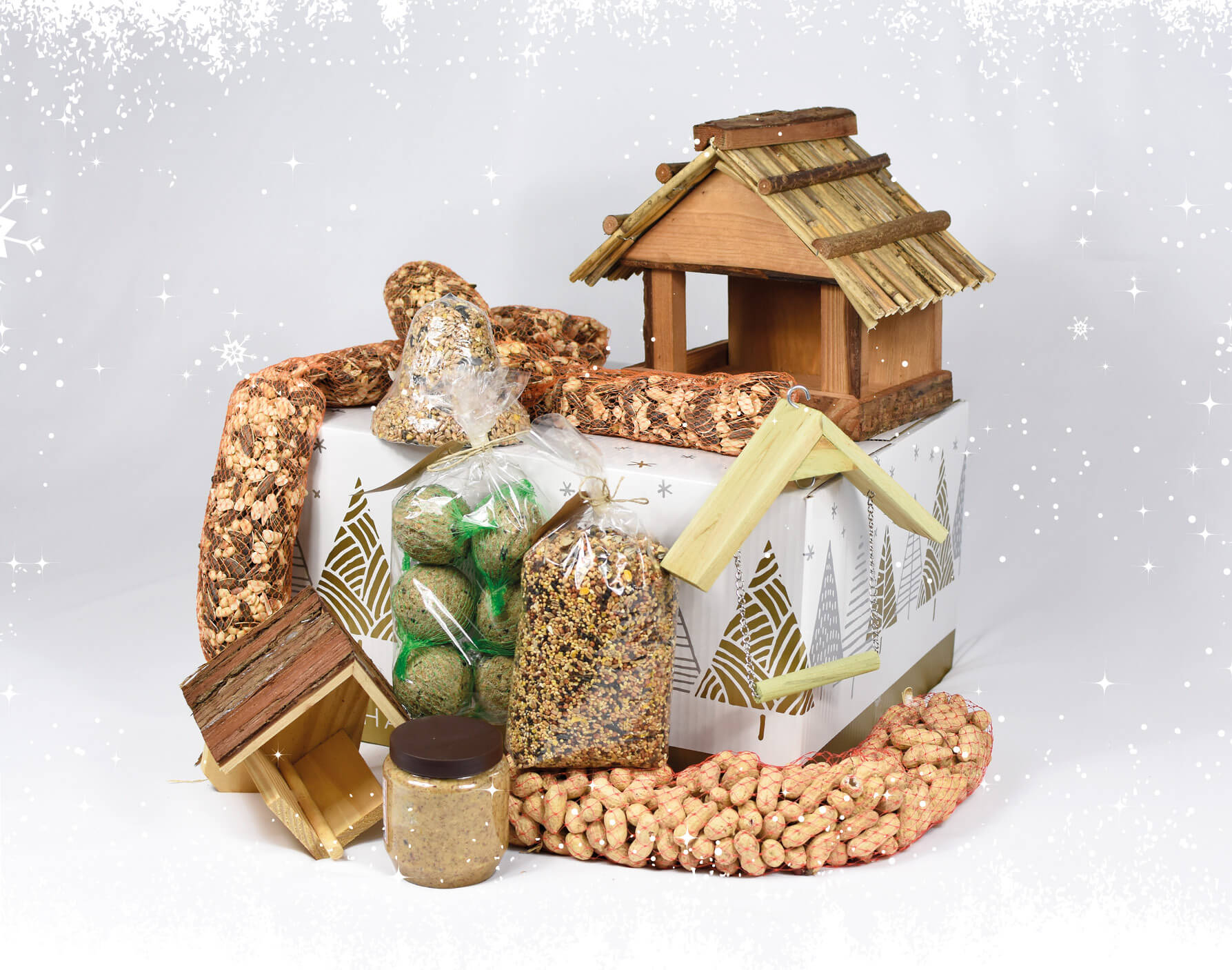 Kerstpakket met voederhuis voor vogels en vogelvoer.