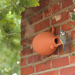 Ovaal vogelhuisje kruik model van terracotta aardewerk